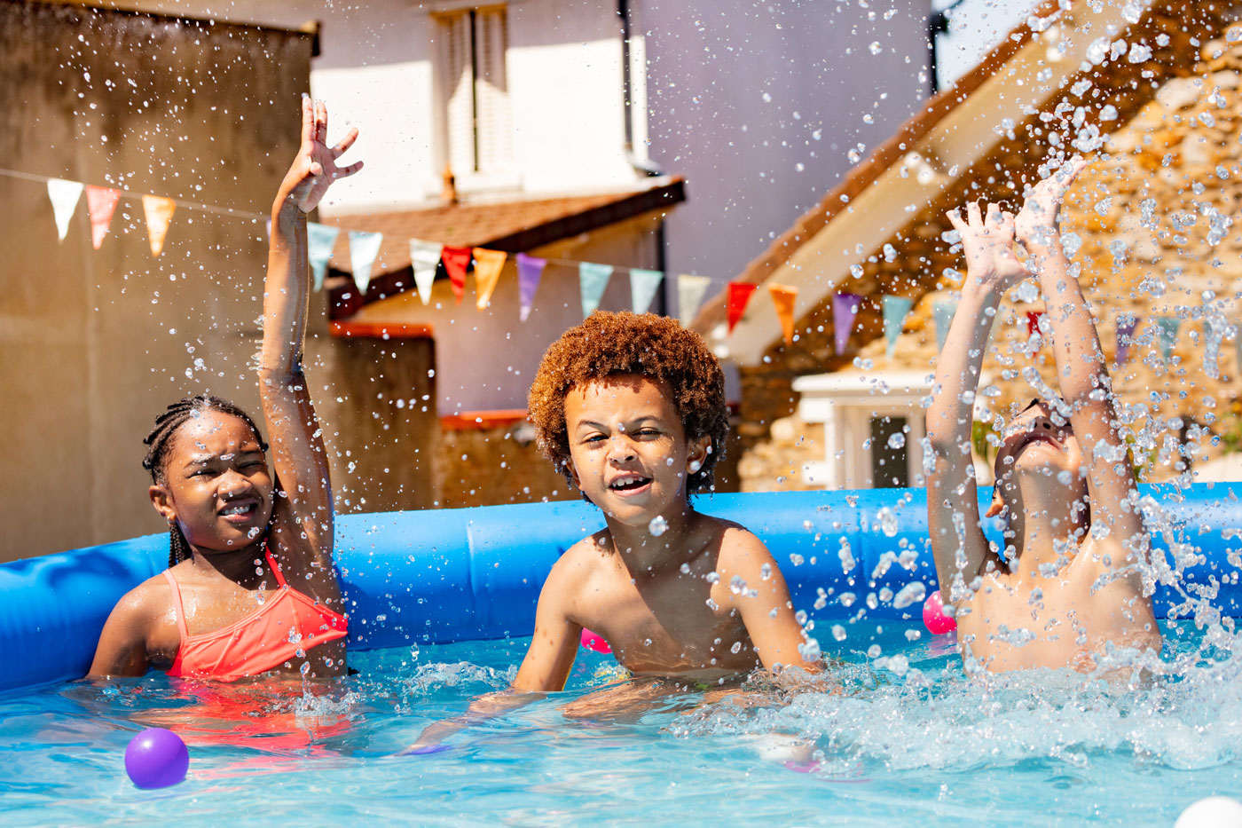 Children playing in a small pool