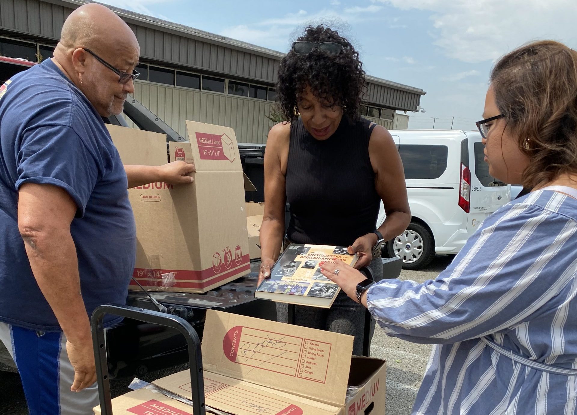 karen unboxing books and donating