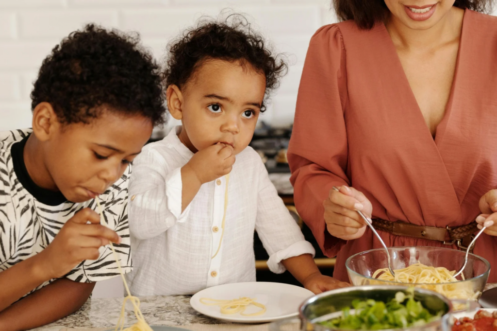 Early years good nutrition of mother preparing meal for her kids