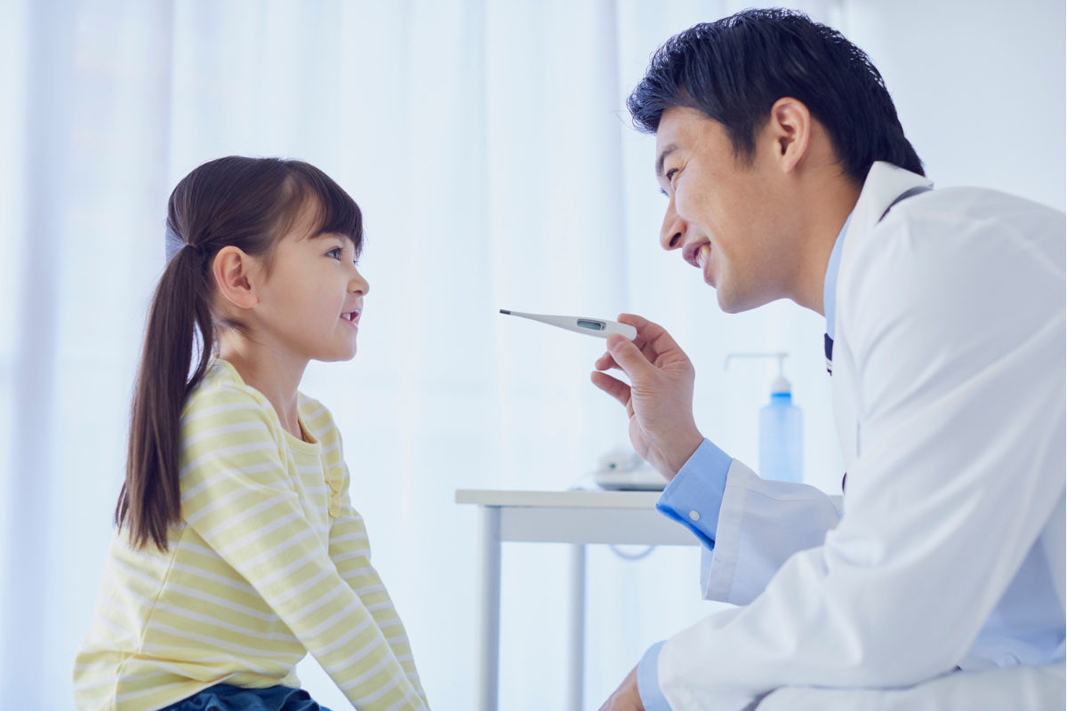 Doctor giving a kid a check up