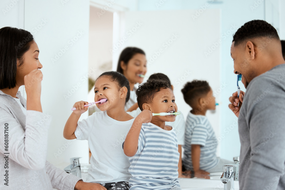 family brushing their teeth